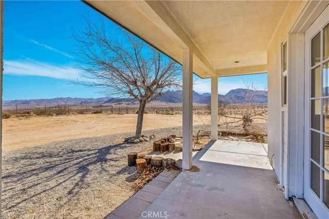 view of patio with a mountain view