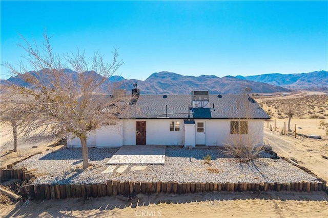 view of front of home with a mountain view