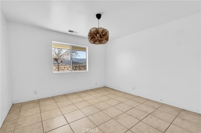 empty room with an inviting chandelier