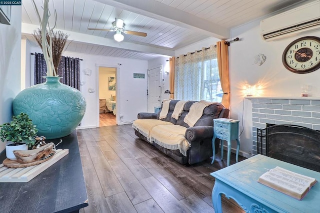 living room featuring hardwood / wood-style flooring, a wall mounted air conditioner, a fireplace, wooden ceiling, and beamed ceiling