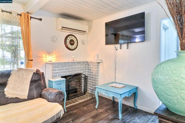 sitting room with an AC wall unit, dark hardwood / wood-style flooring, crown molding, a brick fireplace, and wooden ceiling