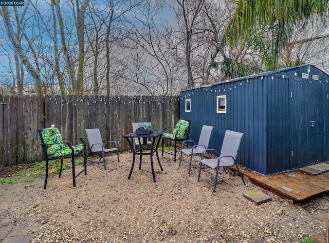 view of patio featuring an outdoor structure