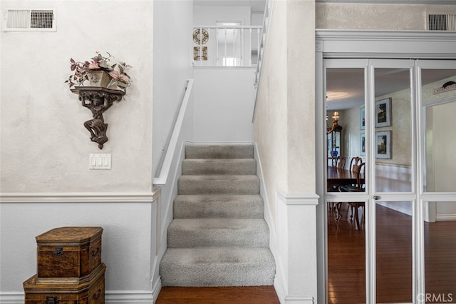 stairway featuring hardwood / wood-style floors