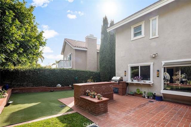 view of patio featuring grilling area and exterior kitchen