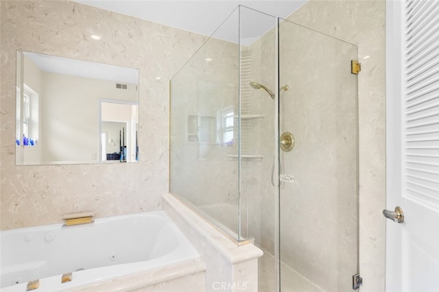 bathroom with shower with separate bathtub