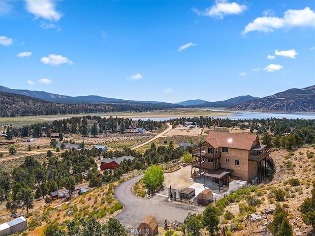 bird's eye view featuring a water and mountain view