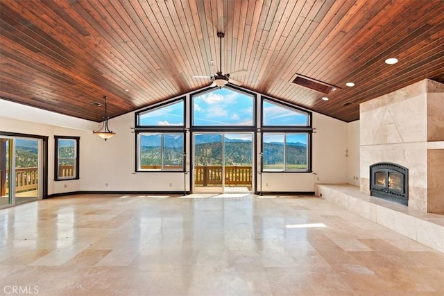 unfurnished living room with wood ceiling, a healthy amount of sunlight, and a high end fireplace