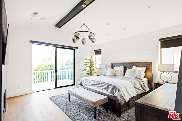 bedroom with an inviting chandelier, light hardwood / wood-style floors, lofted ceiling with beams, and access to outside