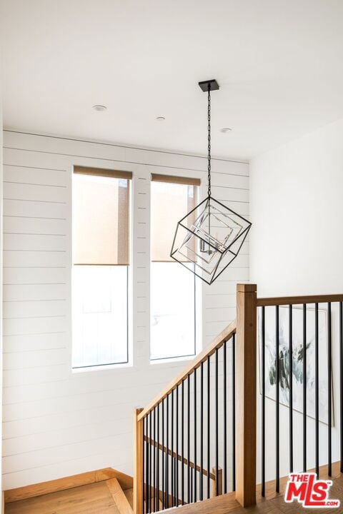 stairs with hardwood / wood-style flooring