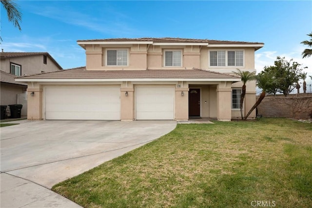 view of front of home with a garage and a front yard