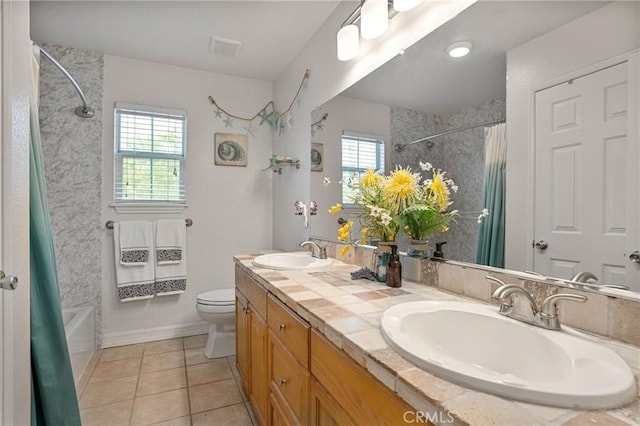 full bathroom with tile patterned flooring, vanity, shower / bath combination with curtain, and toilet