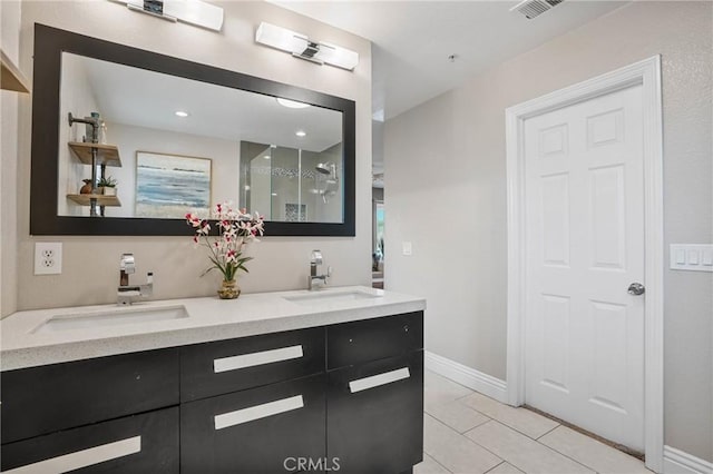 bathroom featuring tile patterned floors and vanity