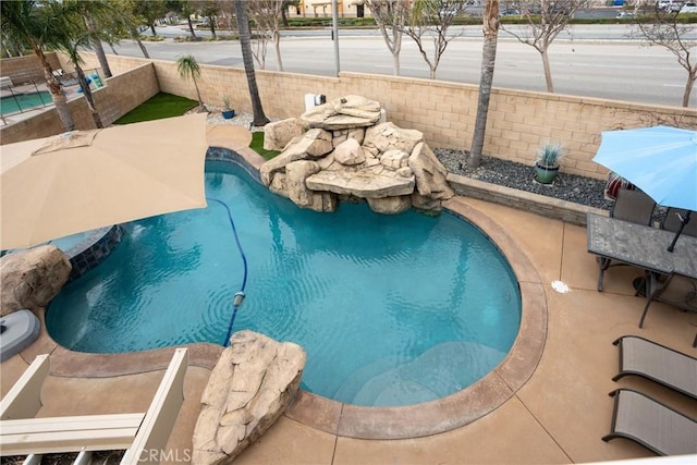 view of swimming pool with a patio