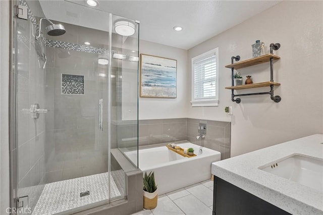 bathroom with tile patterned flooring, vanity, and separate shower and tub