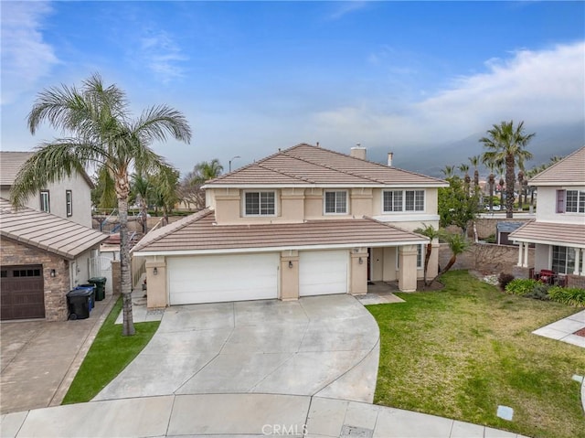 front of property featuring a garage and a front lawn