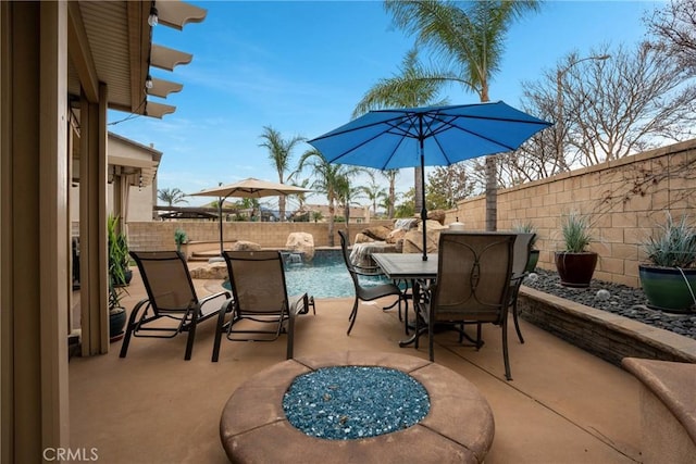 view of patio / terrace with pool water feature and a fenced in pool