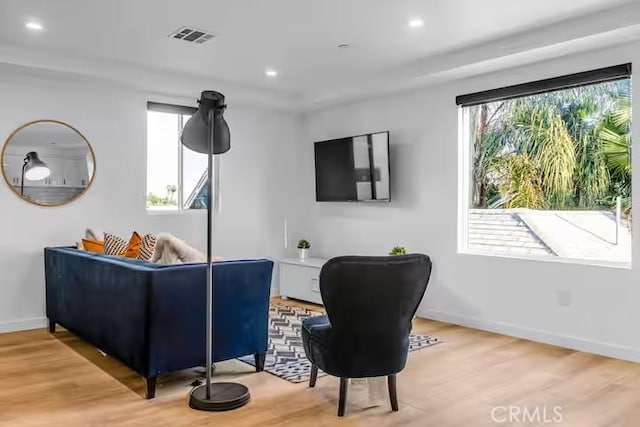 living area with wood-type flooring