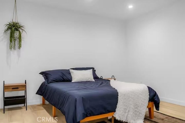 bedroom with light hardwood / wood-style floors