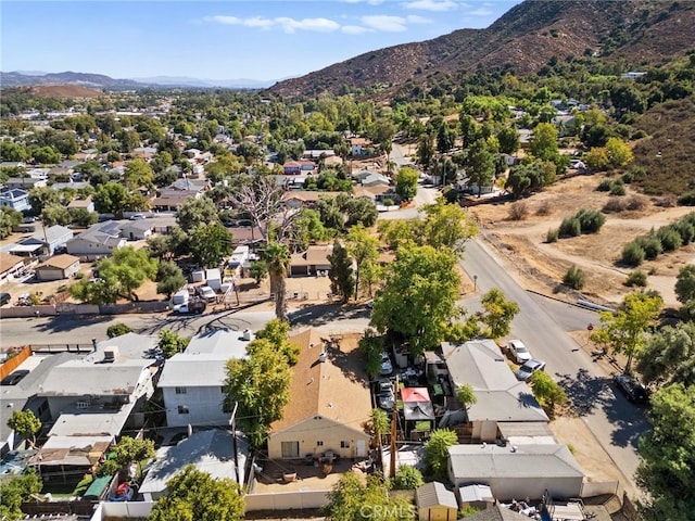 birds eye view of property with a mountain view