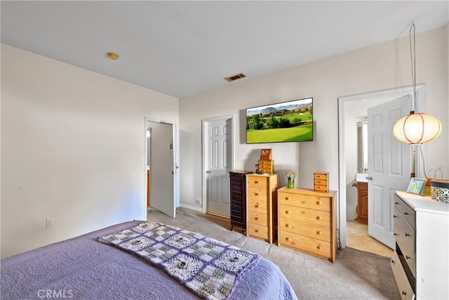 bedroom with light colored carpet