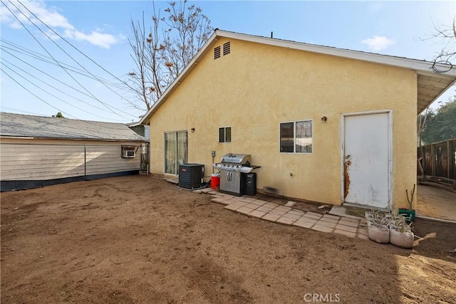 back of house with cooling unit