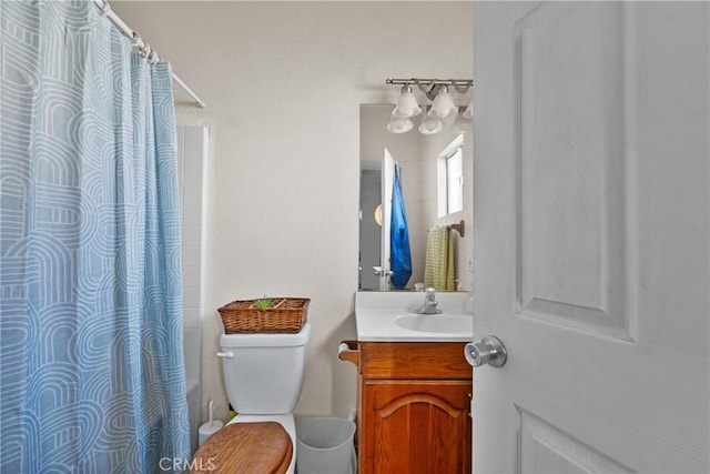 bathroom with vanity, toilet, and a shower with shower curtain