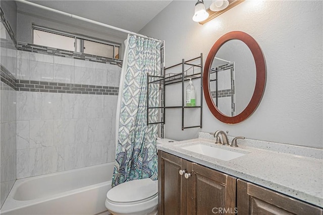 full bathroom featuring vanity, shower / tub combo, and toilet