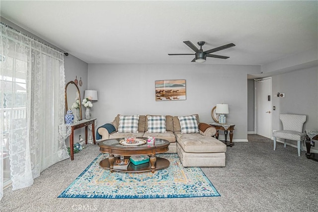 carpeted living room with ceiling fan