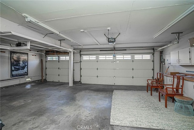 garage featuring a garage door opener