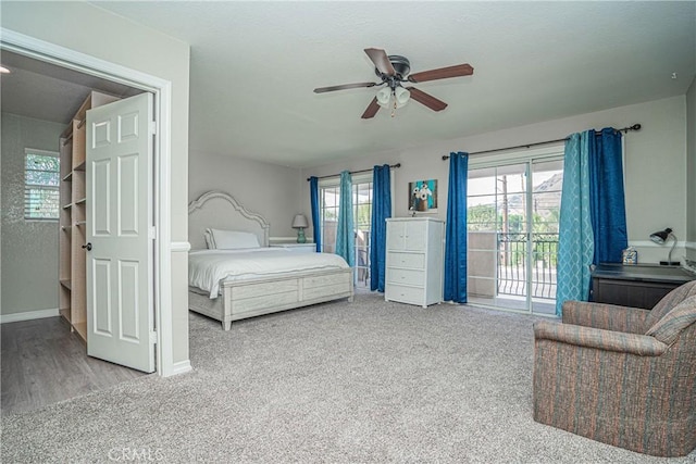 bedroom featuring access to outside, ceiling fan, and carpet flooring