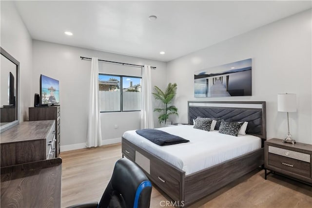 bedroom with light hardwood / wood-style floors