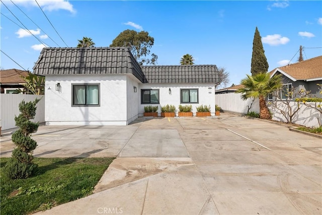 back of property with a patio