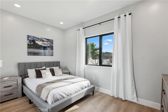 bedroom with light hardwood / wood-style floors