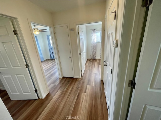 hall with light wood-type flooring