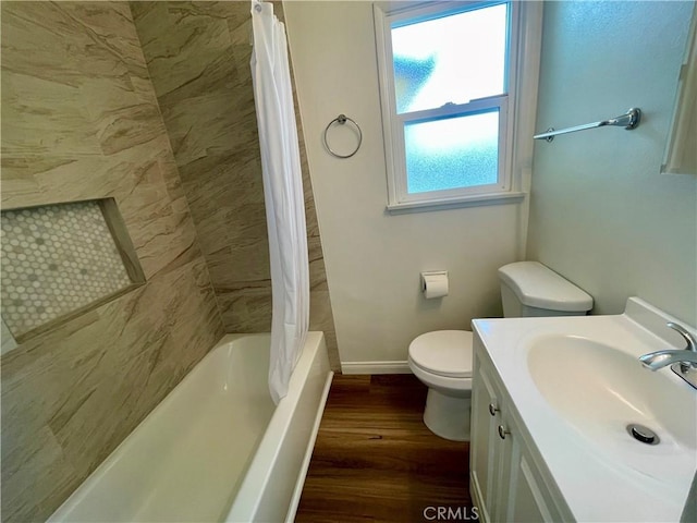 full bathroom featuring vanity, hardwood / wood-style floors, toilet, and shower / bath combo with shower curtain