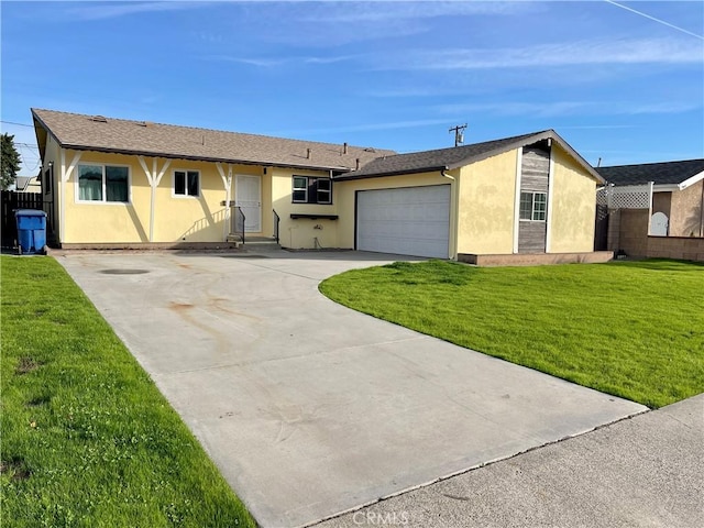 single story home featuring a garage and a front lawn