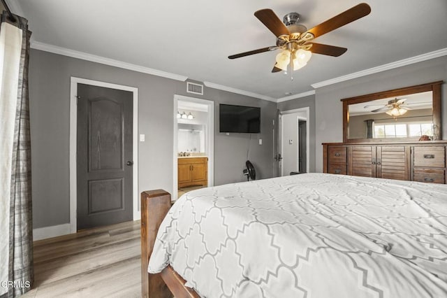 bedroom featuring ornamental molding, ceiling fan, light hardwood / wood-style floors, and ensuite bath