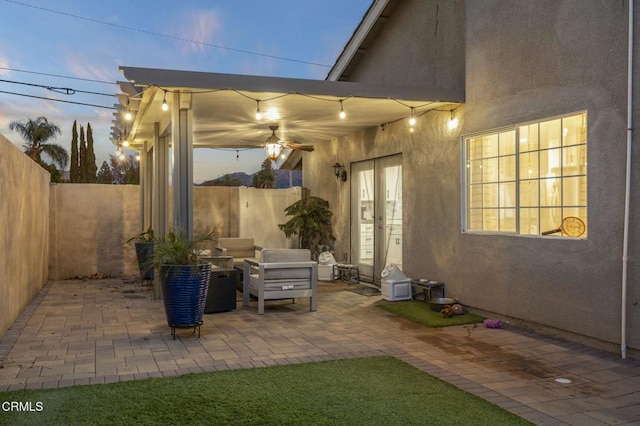 view of patio terrace at dusk