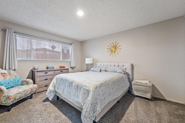 bedroom with carpet flooring and a textured ceiling