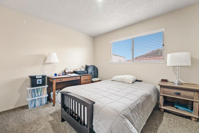 bedroom with carpet and a textured ceiling