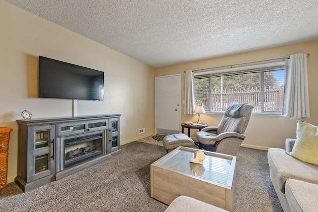 carpeted living room featuring a textured ceiling