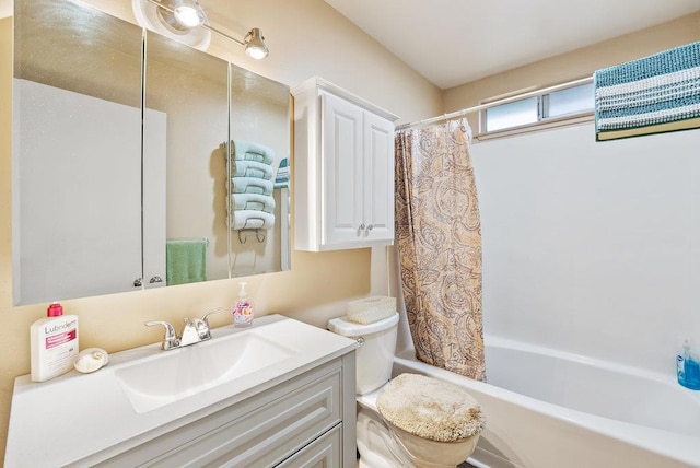 full bathroom with shower / bath combo, vanity, and toilet