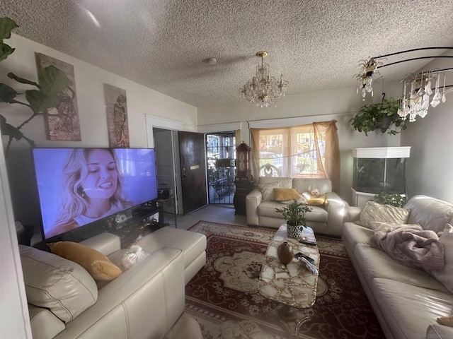 living room with an inviting chandelier, lofted ceiling, and a textured ceiling