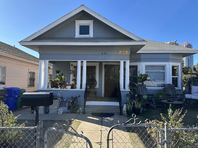 back of house with a porch