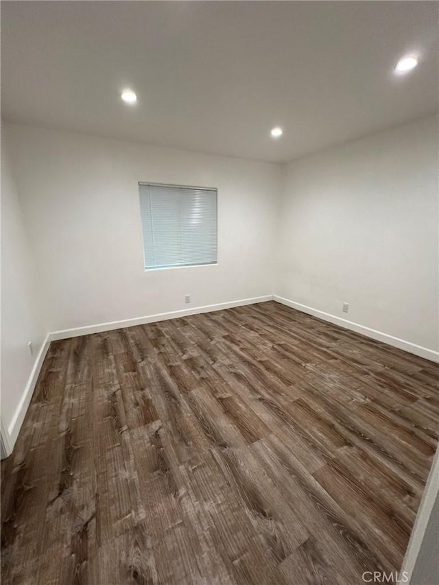 unfurnished room featuring dark hardwood / wood-style floors