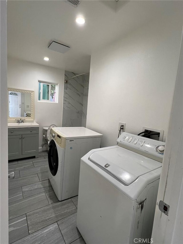 laundry room with separate washer and dryer