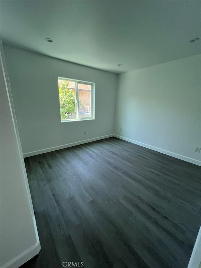 empty room featuring dark hardwood / wood-style floors