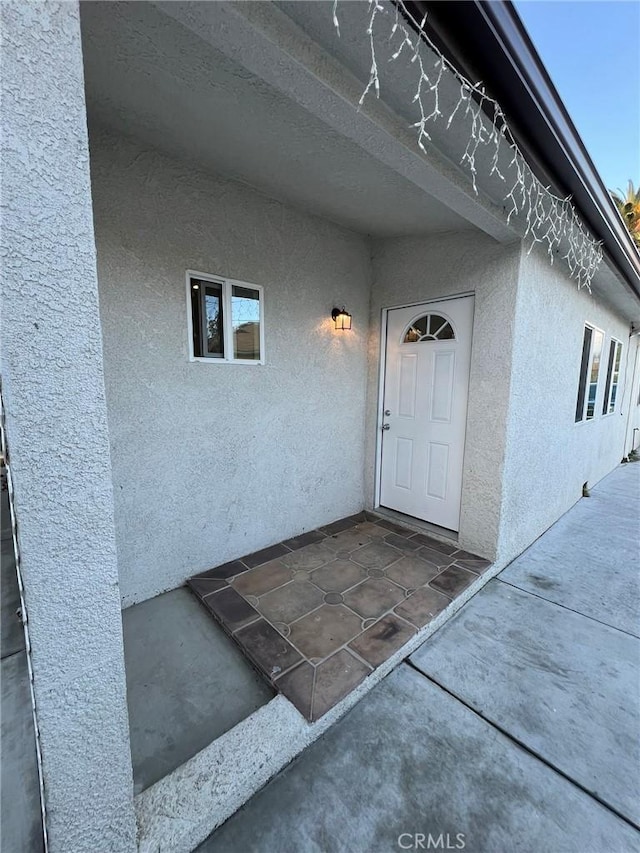 doorway to property featuring a patio