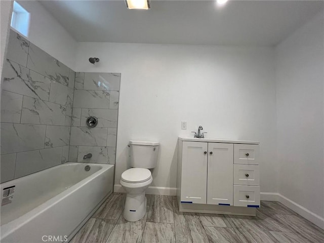 full bathroom with vanity, toilet, and tiled shower / bath