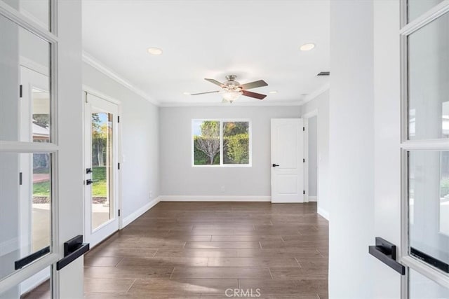 empty room featuring crown molding, ceiling fan, and dark hardwood / wood-style flooring